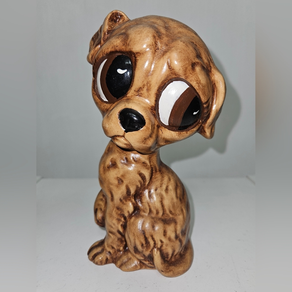 Vintage Ceramic Sad puppy 6 1/2 " tall. Varvar is etched in the bottom.
